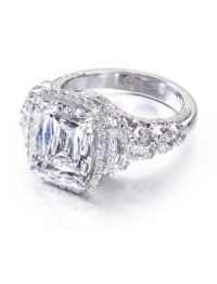 Cushion cut diamond halo engagement ring with round diamond setting